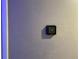 Close up of a programmable smart thermostat on a neutral painted wall at 170 N Fairfax Ave, Winter Springs, FL 32708