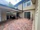 Exterior shot of the brick paved back patio, featuring an outdoor kitchen area at 1815 Townhall Ln # 1815, Orlando, FL 32807