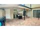 The back patio features a grill, an air conditioner, and brick pavers at 1815 Townhall Ln # 1815, Orlando, FL 32807