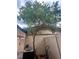 Landscaped backyard featuring a tree and air conditioner at 1815 Townhall Ln # 1815, Orlando, FL 32807