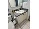 Bathroom featuring a vanity with gray countertops, white cabinetry, and a toilet with above storage at 1815 Townhall Ln # 1815, Orlando, FL 32807