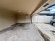 View of carport with access to outdoor space, adjacent to the home's living space at 1815 Townhall Ln # 1815, Orlando, FL 32807