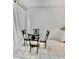 Bright dining area is featured, complete with a round table and seating for four at 1815 Townhall Ln # 1815, Orlando, FL 32807