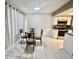 A bright dining area is featured, complete with a round table and seating for four at 1815 Townhall Ln # 1815, Orlando, FL 32807