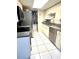 Bright kitchen area shows stainless steel appliances and storage at 1815 Townhall Ln # 1815, Orlando, FL 32807