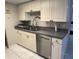 The kitchen area boasts stainless steel appliances, including a dishwasher at 1815 Townhall Ln # 1815, Orlando, FL 32807