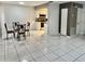The dining area features tile floors and an open view of the kitchen at 1815 Townhall Ln # 1815, Orlando, FL 32807