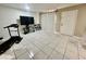 The living room features tile floors, a TV, and seating at 1815 Townhall Ln # 1815, Orlando, FL 32807