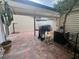 Large outdoor patio with grill and shaded area at 1815 Townhall Ln # 1815, Orlando, FL 32807