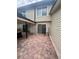 Brick paver patio with grill, providing a relaxed outdoor area with convenient home access at 1815 Townhall Ln # 1815, Orlando, FL 32807