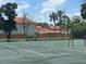 Well-maintained community tennis court with green surface, perfect for recreational play at 1815 Townhall Ln # 1815, Orlando, FL 32807