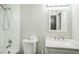 Updated bathroom with modern vanity, white walls, and a combined shower and tub at 1840 Orange View Ct, Kissimmee, FL 34746