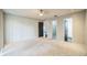 Spacious bedroom with ceiling fan, plush carpet, and adjoining bathroom and closet at 1840 Orange View Ct, Kissimmee, FL 34746