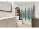 Bathroom with a vanity and mirror, a toilet, and a shower with forest-themed curtains at 2142 Woodbridge Rd, Longwood, FL 32779