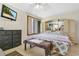 Serene bedroom with neutral tones, features a TV and a large window at 2142 Woodbridge Rd, Longwood, FL 32779