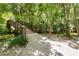 Picturesque bridge surrounded by lush trees and flowing water, creating a tranquil escape at 2142 Woodbridge Rd, Longwood, FL 32779