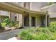 Inviting entrance with covered parking and lush landscaping enhances this home's curb appeal at 2142 Woodbridge Rd, Longwood, FL 32779