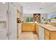Kitchen with ample counter space and cabinets, seamlessly connecting to the living area at 2142 Woodbridge Rd, Longwood, FL 32779