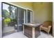 Cozy patio with an outdoor table and wicker chairs, perfect for relaxing outdoors at 2142 Woodbridge Rd, Longwood, FL 32779