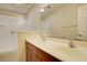 Bathroom featuring a double sink vanity with wood cabinets, shower, and tile flooring at 2901 Ashford Park Pl, Oviedo, FL 32765