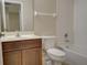 A bathroom with a shower and tub combo, with a dark wood vanity and sink at 2901 Ashford Park Pl, Oviedo, FL 32765