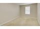 Bedroom featuring neutral walls, carpeted floors, and a window, offering a bright space at 2901 Ashford Park Pl, Oviedo, FL 32765