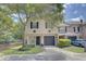 Two story townhome with a one car garage and green landscaping at 2901 Ashford Park Pl, Oviedo, FL 32765