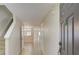Bright foyer with tile flooring, staircase, and views into adjacent living spaces at 2901 Ashford Park Pl, Oviedo, FL 32765