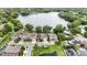 Stunning aerial view of lakeside community featuring beautiful homes, lush trees, and tranquil waters at 2922 Reef Knot Pl, Winter Park, FL 32792