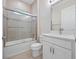 This bathroom boasts modern finishes, a bathtub, a shower, and white cabinets at 2922 Reef Knot Pl, Winter Park, FL 32792
