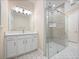 Bathroom featuring frameless glass shower and vanity with white cabinetry at 2922 Reef Knot Pl, Winter Park, FL 32792