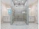 Modern bathroom with frameless glass shower, double vanity, and hexagon tile flooring at 2922 Reef Knot Pl, Winter Park, FL 32792