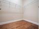 Walk-in closet featuring hardwood floors and wire shelving at 2922 Reef Knot Pl, Winter Park, FL 32792