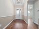 Elegant foyer featuring hardwood floors, a decorative front door, and ample natural light at 2922 Reef Knot Pl, Winter Park, FL 32792