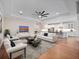Bright and airy living room seamlessly connects to the kitchen for modern, open-concept living at 2922 Reef Knot Pl, Winter Park, FL 32792
