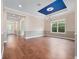 Open floor plan showcasing hardwood floors, tray ceiling and natural light at 2922 Reef Knot Pl, Winter Park, FL 32792