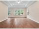 Expansive living room with hardwood flooring, recessed lighting, and large windows offering natural light at 2922 Reef Knot Pl, Winter Park, FL 32792