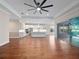 Open floor plan with kitchen, living room, hardwood floors, and recessed lighting at 2922 Reef Knot Pl, Winter Park, FL 32792