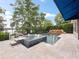 This in-ground pool features a spa, a rock waterfall, and travertine pavers at 2922 Reef Knot Pl, Winter Park, FL 32792