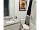 Bright bathroom featuring granite counters, white cabinets, and a shower with a stylish black and white curtain at 29783 Anahid Dr, Leesburg, FL 34748