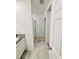 Bathroom with tiled floors, granite countertops and a glass shower door at 29783 Anahid Dr, Leesburg, FL 34748