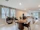 Dining area leading to the kitchen and living area, offering an open and inviting space at 29783 Anahid Dr, Leesburg, FL 34748