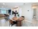 Dining area adjacent to the kitchen and living area, creating an open and connected living space at 29783 Anahid Dr, Leesburg, FL 34748