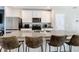 Kitchen featuring stainless appliances, granite countertops, with bar stool seating at 29783 Anahid Dr, Leesburg, FL 34748