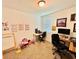 A cozy office with dual workstations, and decor at 29783 Anahid Dr, Leesburg, FL 34748