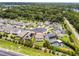 Aerial view of the property in a cul-de-sac, surrounded by lush greenery and well-maintained homes at 3172 Jade Tree Pt, Oviedo, FL 32765