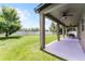 Spacious backyard with a covered patio and a lush green lawn, great for outdoor living at 3172 Jade Tree Pt, Oviedo, FL 32765