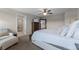 Serene bedroom with a view to an adjacent bathroom, a dresser, and a large mirror at 3172 Jade Tree Pt, Oviedo, FL 32765