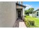 Inviting front door with a decorative wreath and brick walkway at 3172 Jade Tree Pt, Oviedo, FL 32765