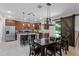 Modern kitchen featuring stainless steel appliances, granite countertops, and a breakfast bar at 3172 Jade Tree Pt, Oviedo, FL 32765
